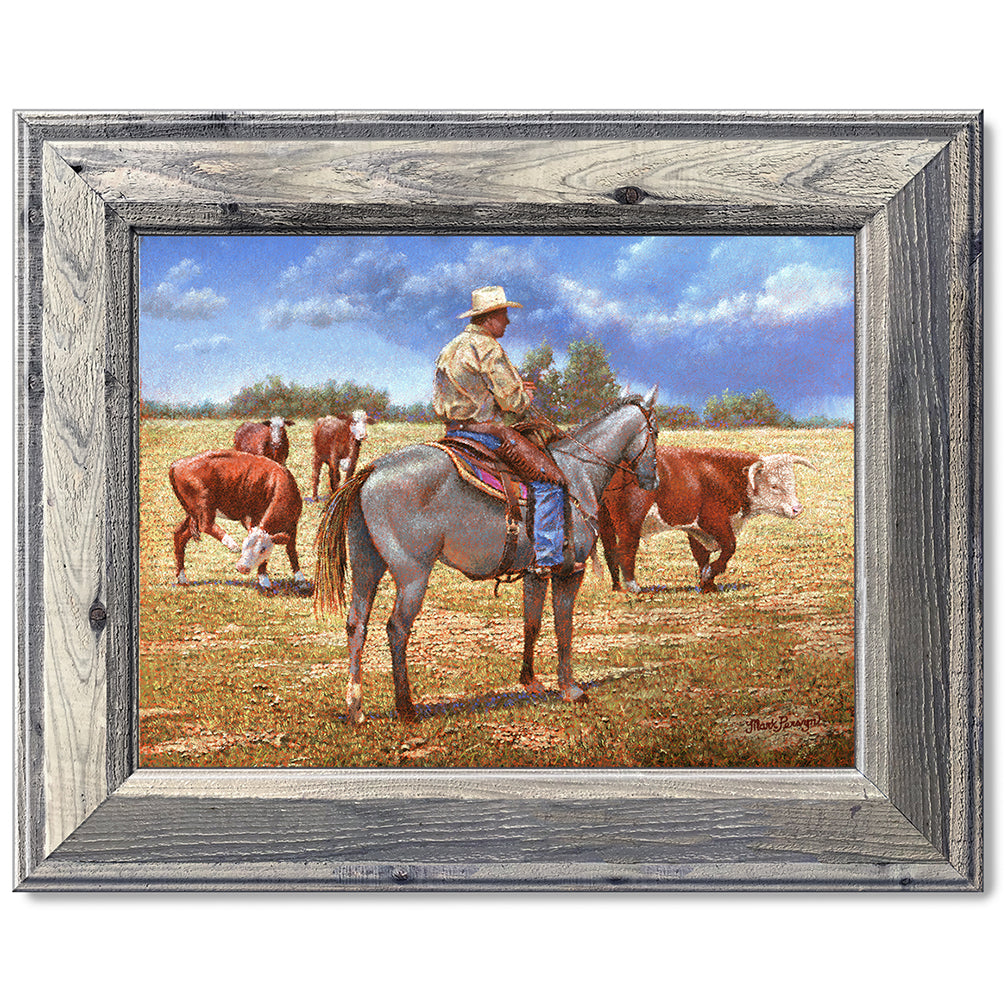 canvas print in a grey wood frame depicting a cowboy on
horseback herding herefords with rain showers in the distance