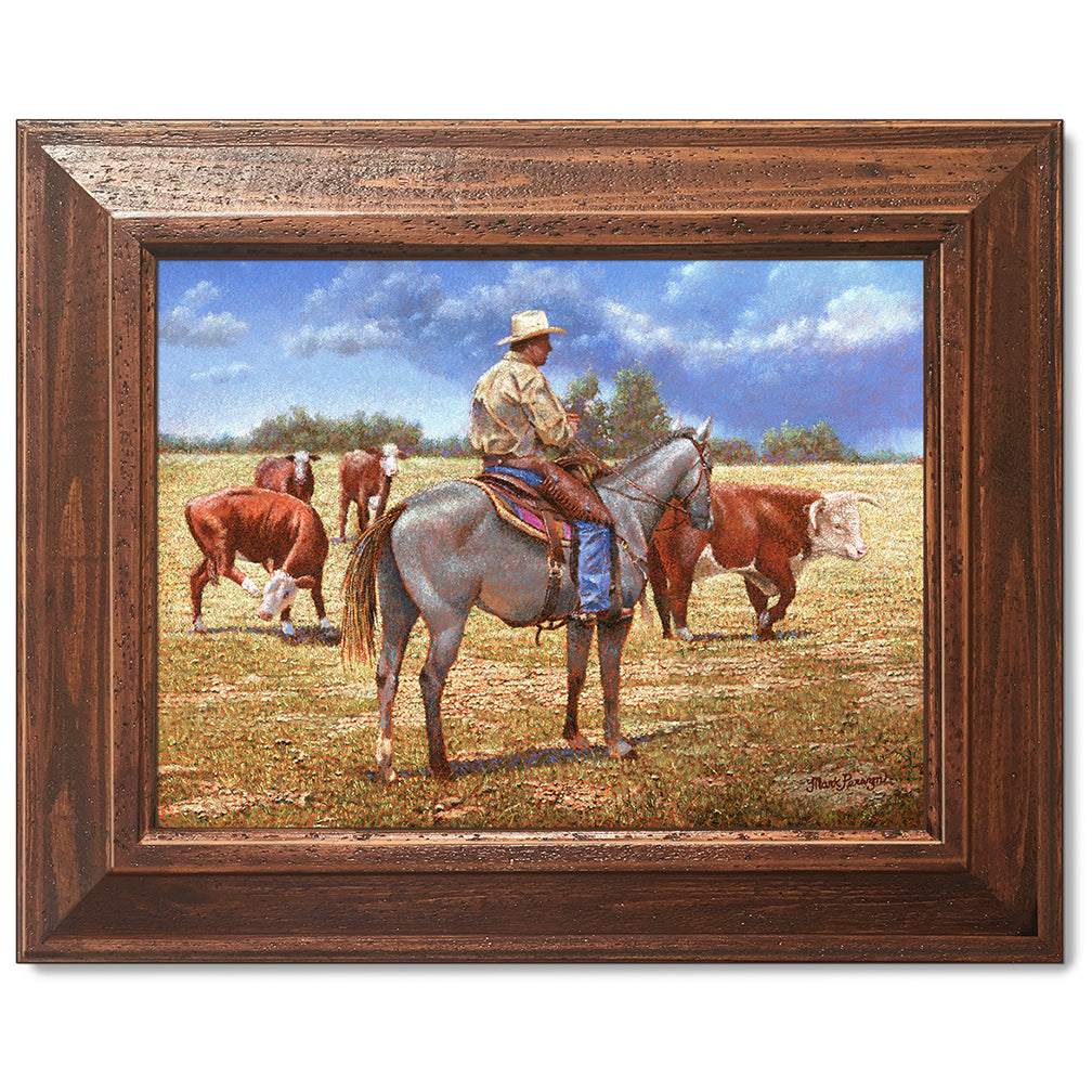 canvas print in a brown wood frame depicting a cowboy on
horseback herding herefords with rain showers in the distance