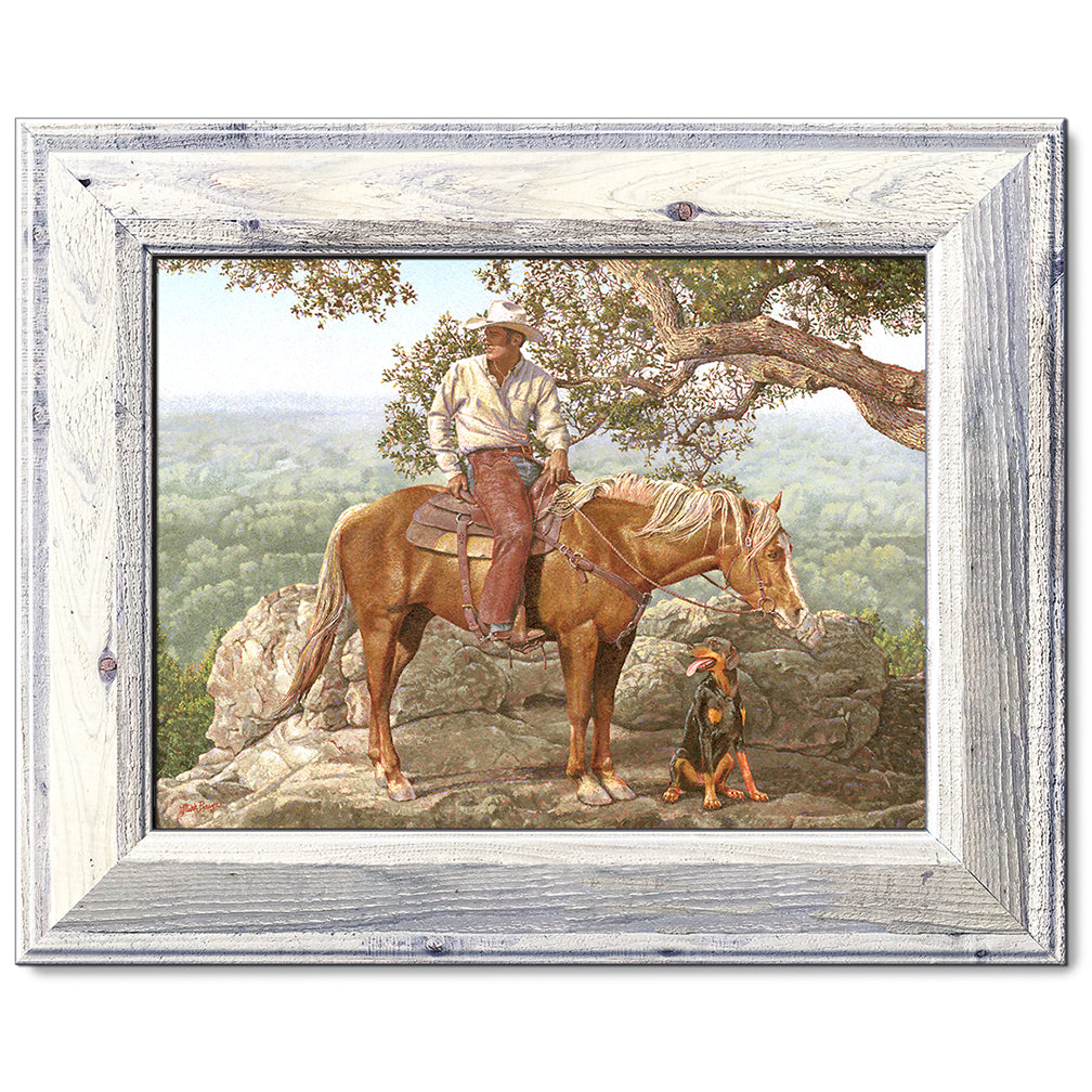 canvas print in a white wood frame depicting a cowboy on
horseback with his dog alongside