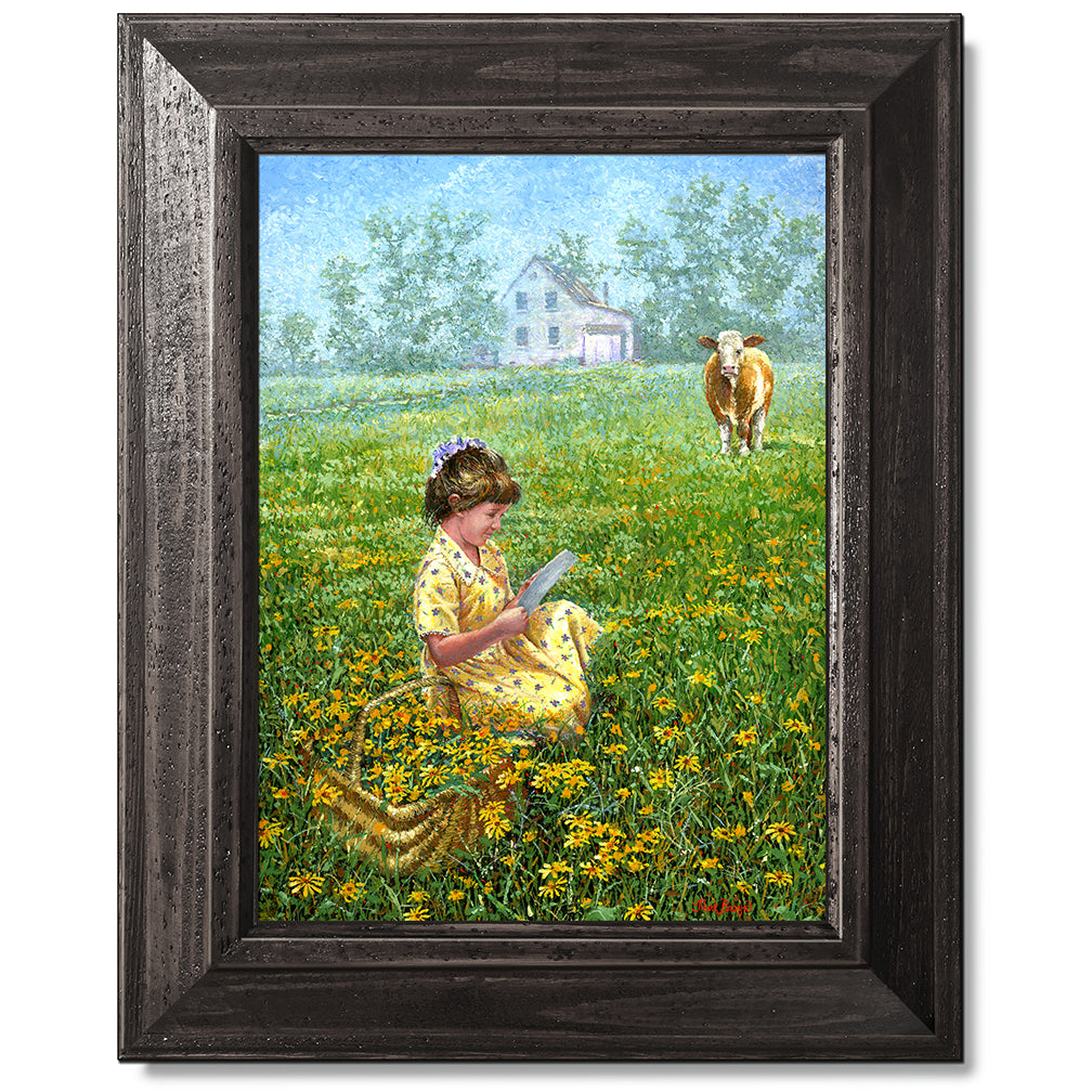 canvas print in a black wood frame depicting a little girl reading a
letter in a country field as a cow looks on