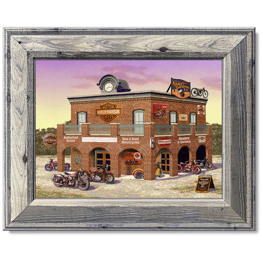 canvas print in a grey wood frame depicting classic motorcycles
parked in front of a vintage harley-davidson dealership