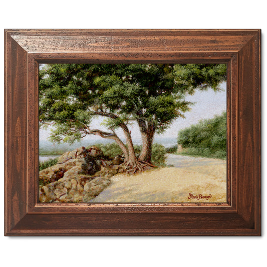 canvas print in a brown wood frame depicting a large oak tree
next to a country road