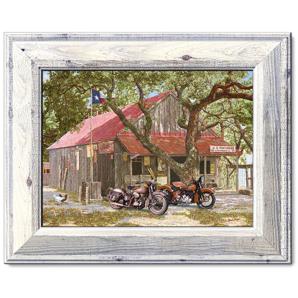 canvas print in a white wood frame depicting classic motorcycles
parked in front of the luckenbach, texas post office