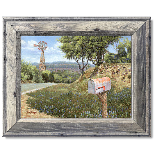 canvas print in a grey wood frame depicting a mailbox along a
country road with a windmill in the background
