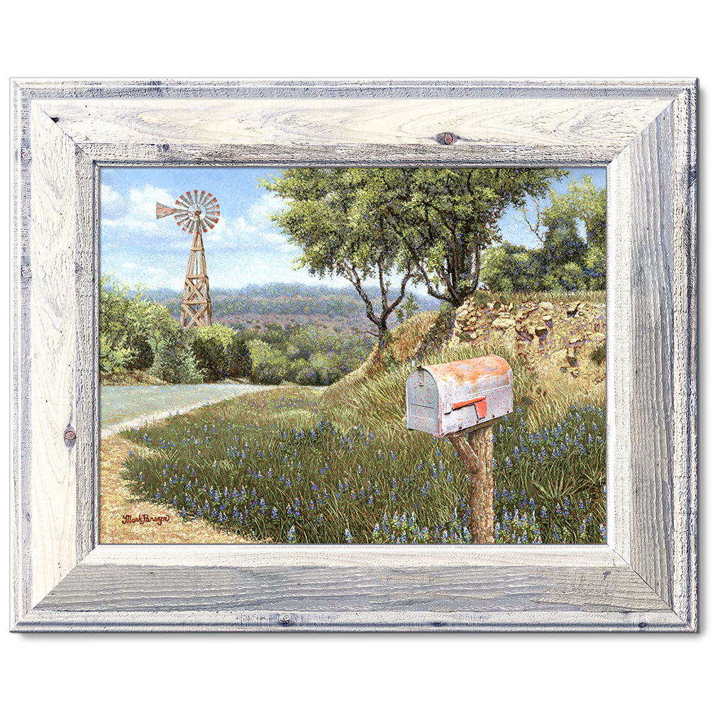 canvas print in a white' wood frame showing a mailbox along a
country road with a windmill in the background