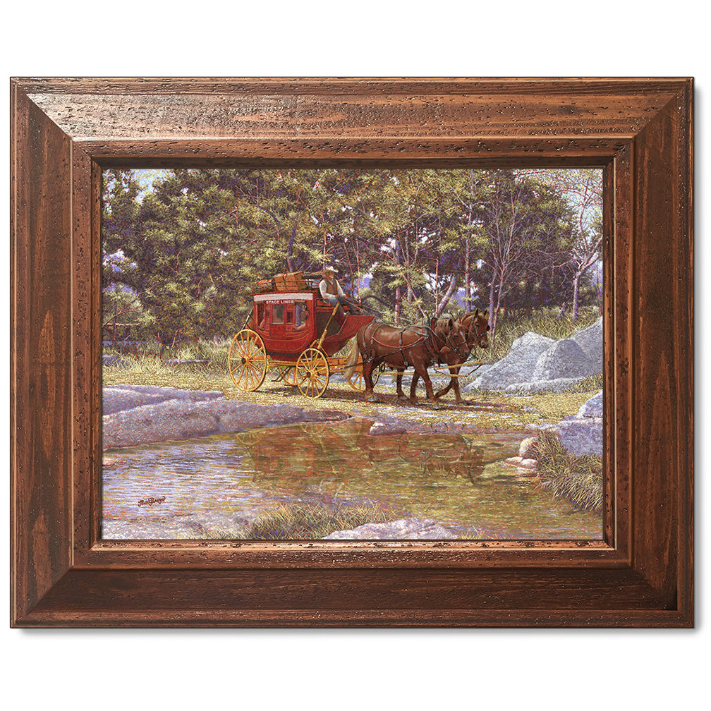 canvas print in a brown wood frame depicting a stagecoach traveling through a creek in a country landscape