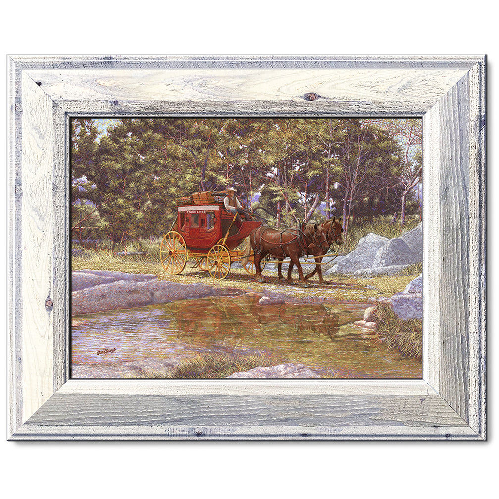 canvas print in a white wood frame depicting a stagecoach traveling through a creek in a country landscape