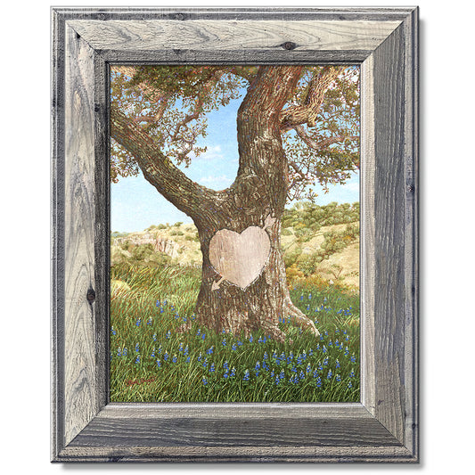 canvas print in a grey wood frame depicting an ancient oak tree
with a carved heart in a field of bluebonnets