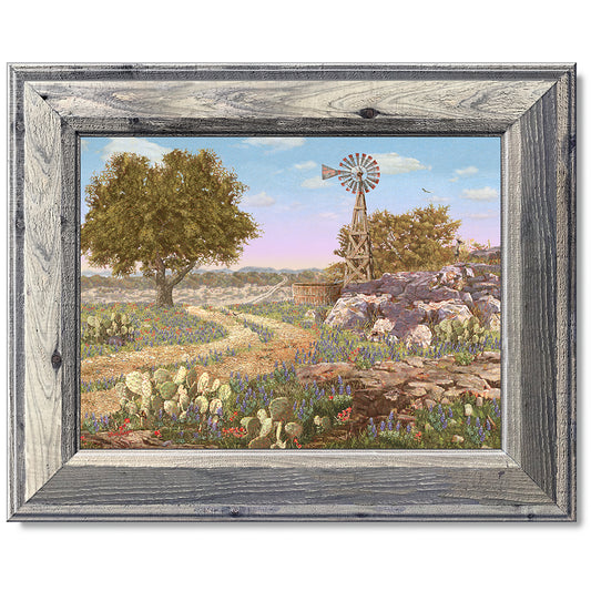 canvas print in a grey wood frame depicting a hill country landscape
with wildflowers, cactus, windmill and eleven hidden animals