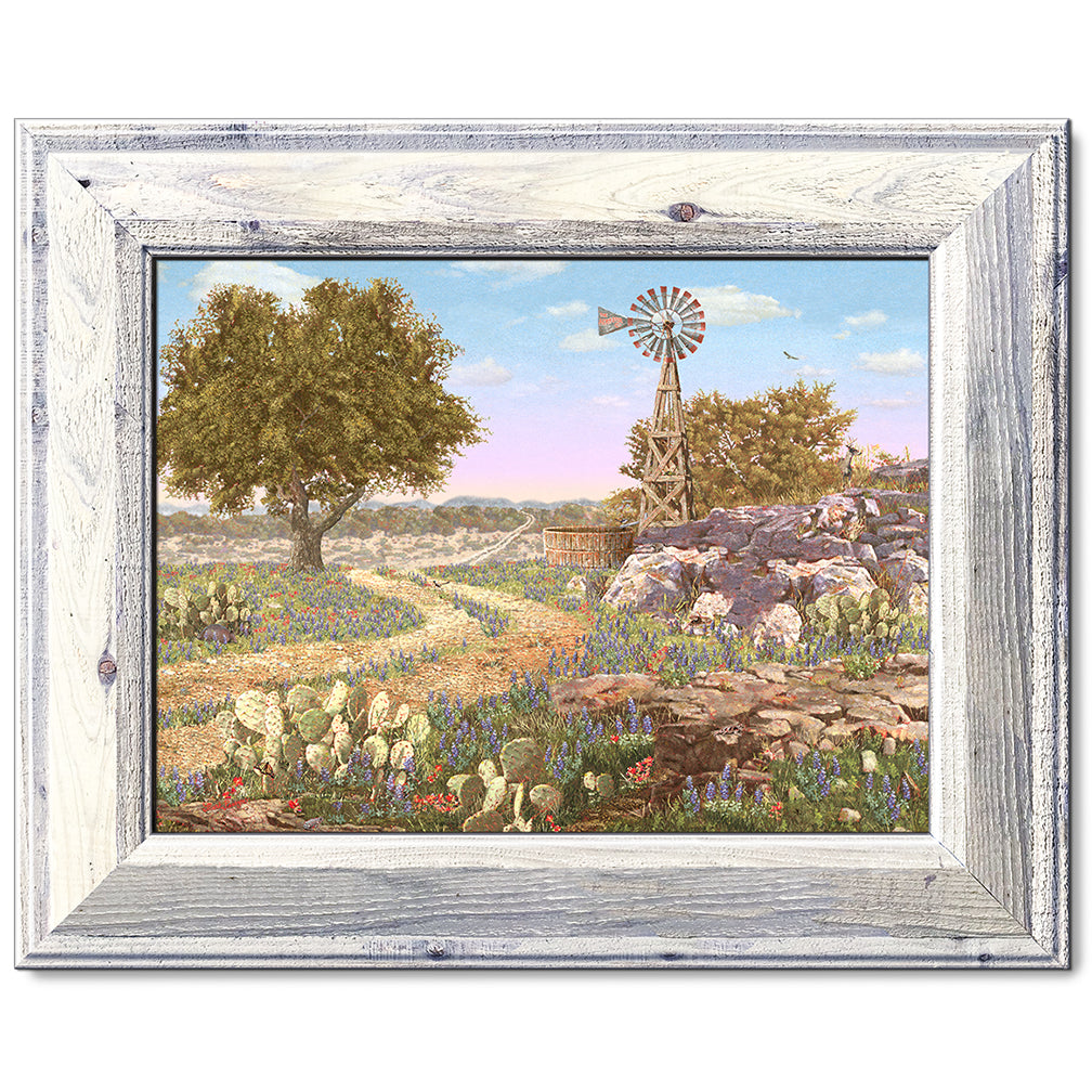 canvas print in a white wood frame depicting a hill country landscape
with wildflowers, cactus, windmill and eleven hidden animals