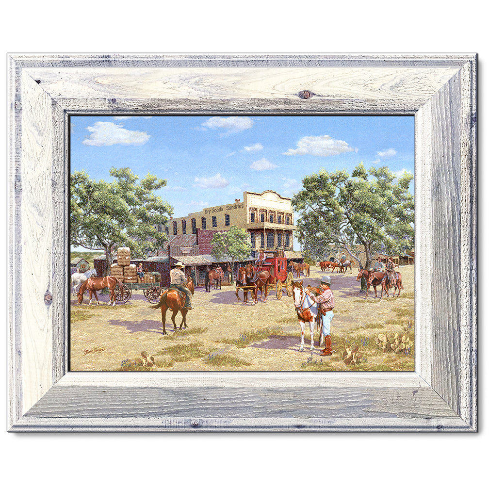 canvas print in a white wood frame depicting a 1800’s western
town scene with cowboys on horseback