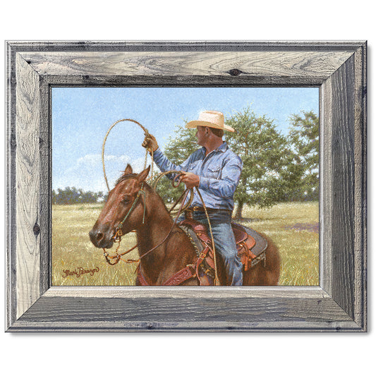 canvas print in a grey wood frame depicting a calf roper on
horseback holding his rope in a country landscape