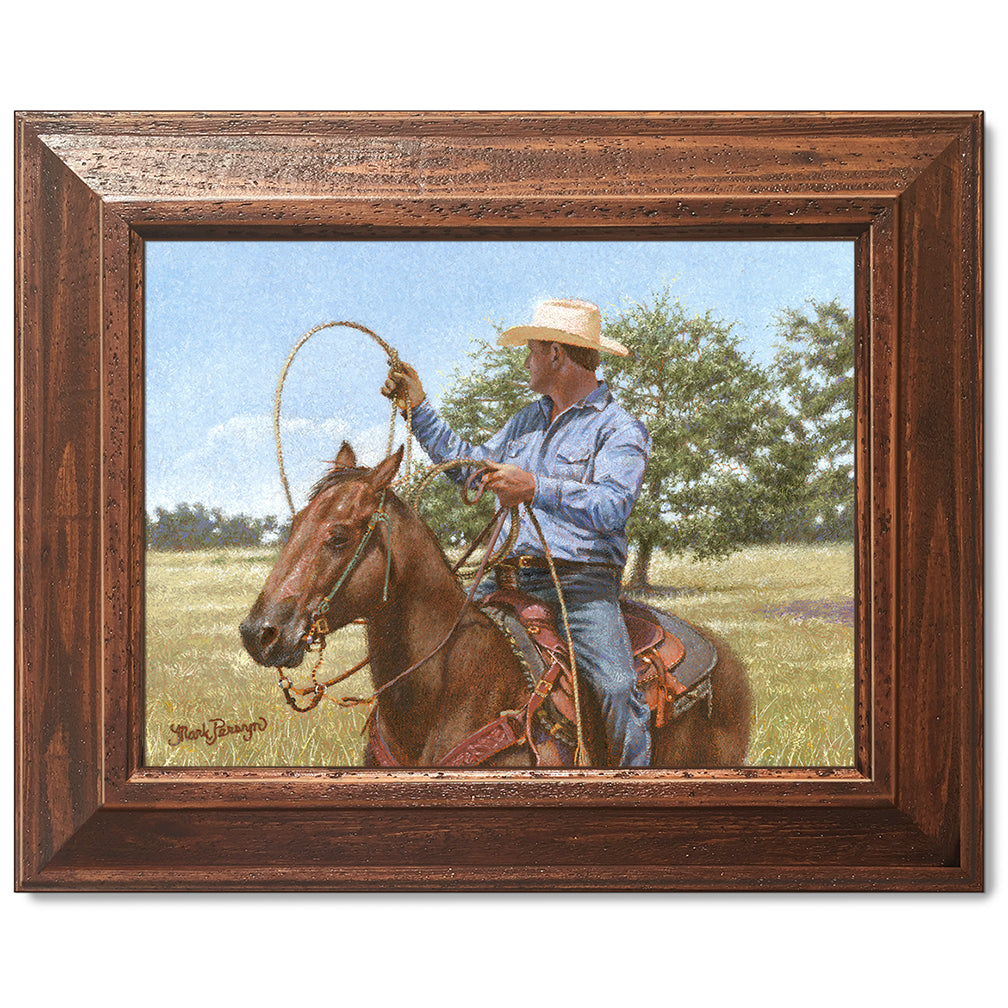 canvas print in a brown wood frame depicting a calf roper on
horseback holding his rope in a country landscape