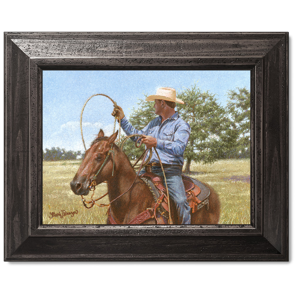 canvas print in a black wood frame depicting a calf roper on
horseback holding his rope in a country landscape