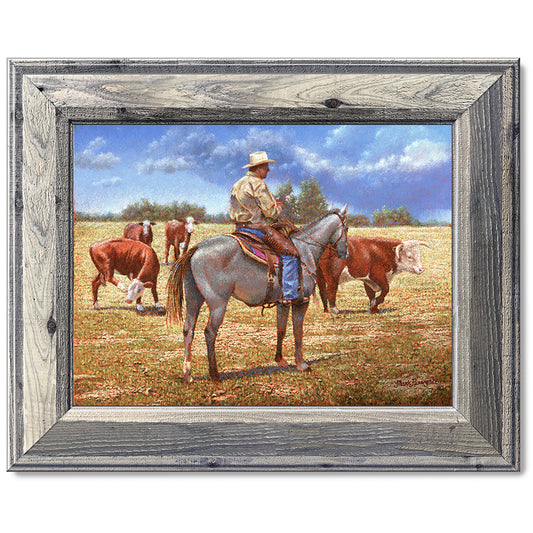 canvas print in a grey wood frame depicting a cowboy on 
horseback herding herefords with rain showers in the distance 