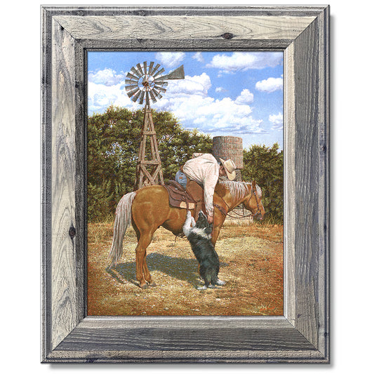 canvas print in a grey wood frame depicting a cowboy on
horseback leaning over petting his border collie 