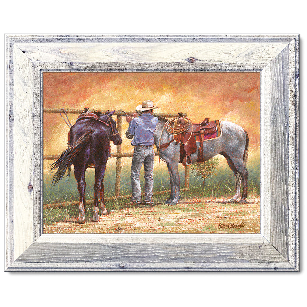 canvas print in a white wood frame depicting a cowboy standing
between two horses while a dust devil dances around them