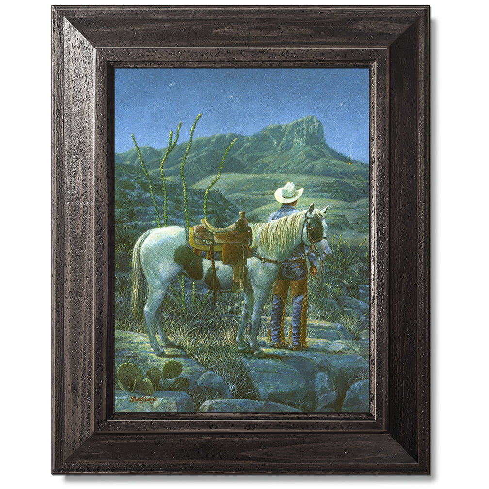 canvas print in a black wood frame depicting a cowboy next to his
horse looking at a signal fire below guadalupe peak