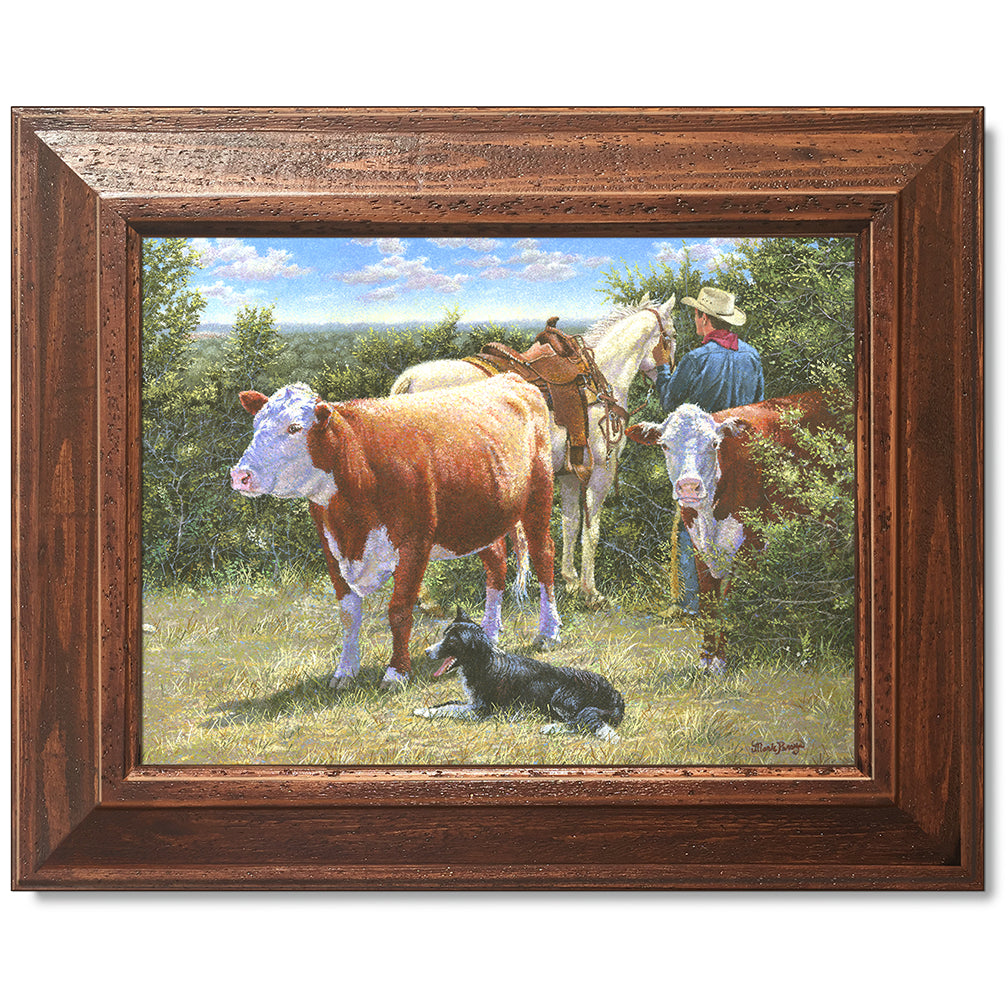 canvas print in a brown wood frame depicting a cowboy with his
horse, herefords, and his border collie