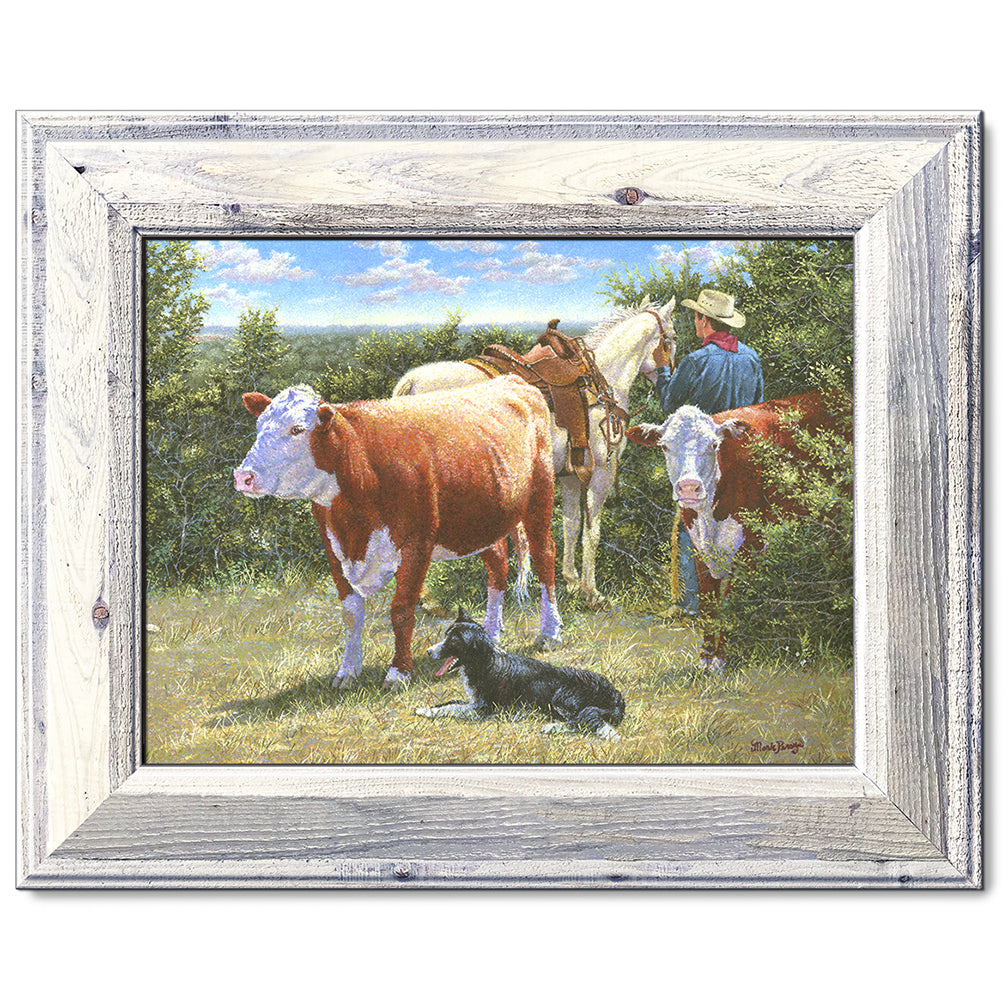 canvas print in a white wood frame depicting a cowboy with his
horse, herefords, and his border collie