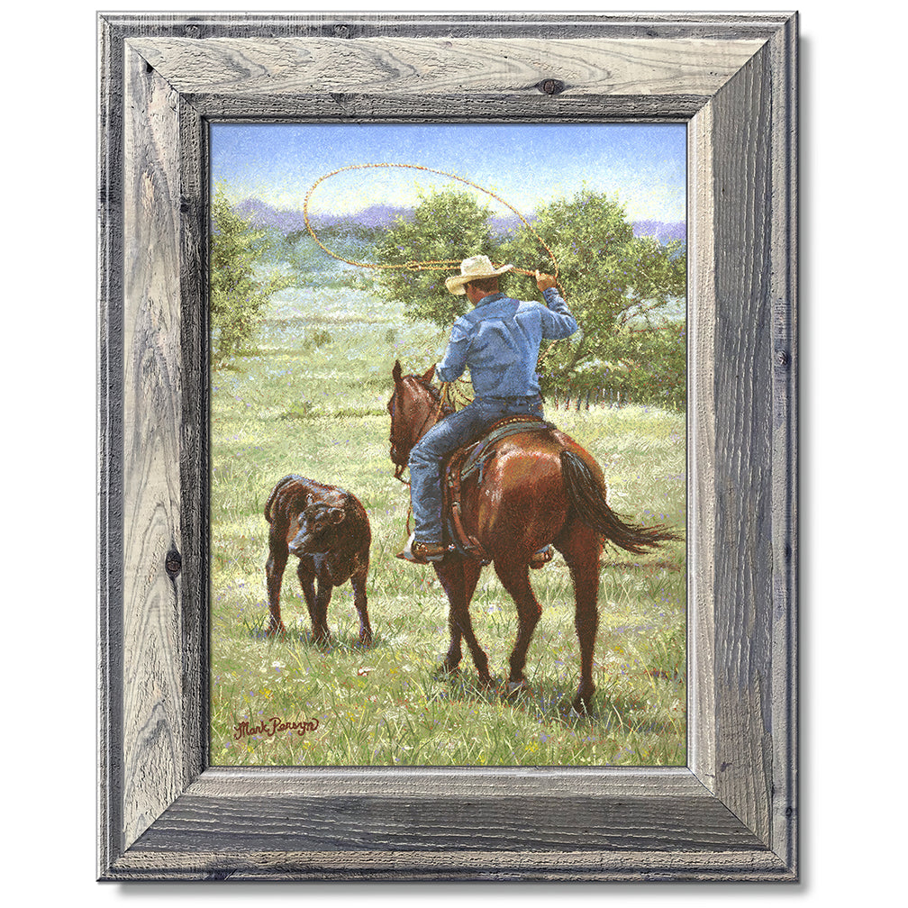 canvas print in a grey wood frame depicting a cowboy on 
horseback ready to rope a black angus calf