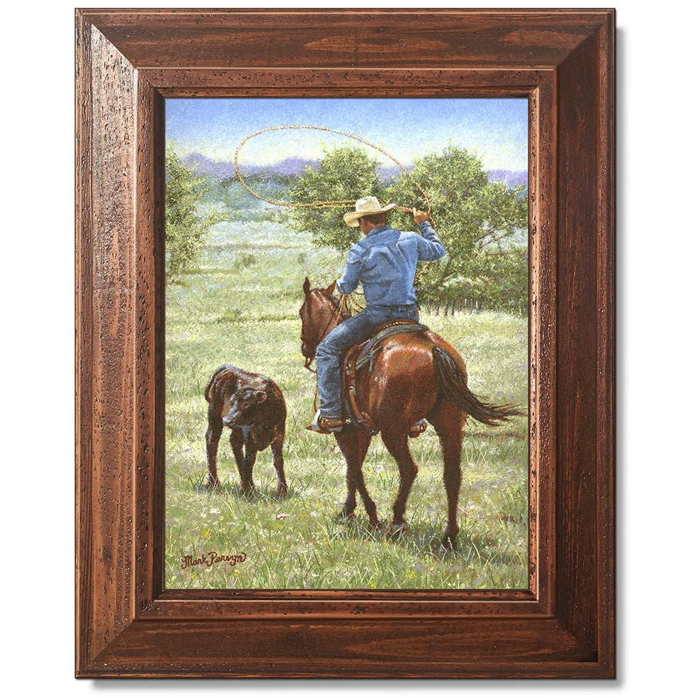 canvas print in a brown wood frame depicting a cowboy on 
horseback ready to rope a black angus calf