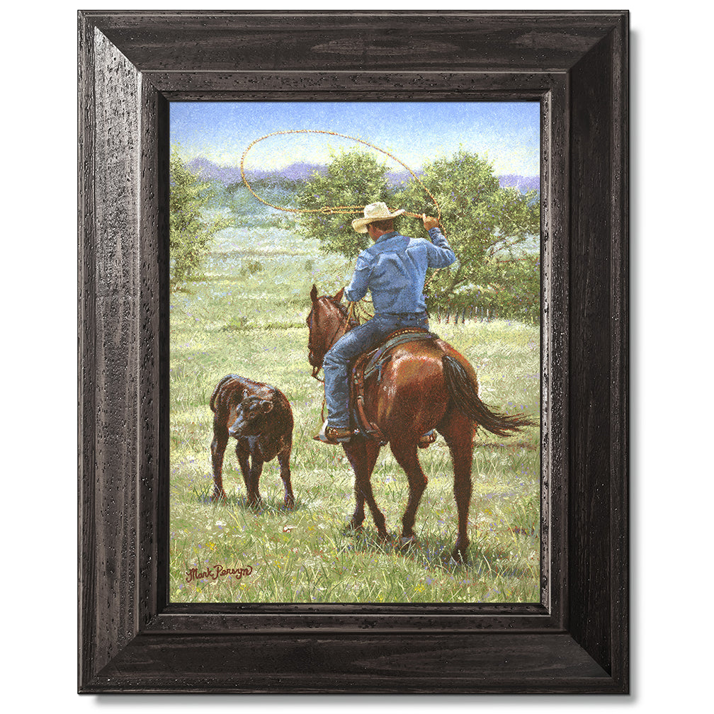 canvas print in a black wood frame depicting a cowboy on 
horseback ready to rope a black angus calf