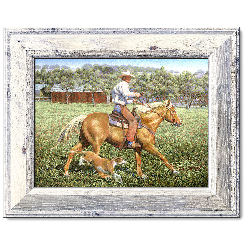 canvas print in a white wood frame depicting a cowboy on
horseback with his dog alongside