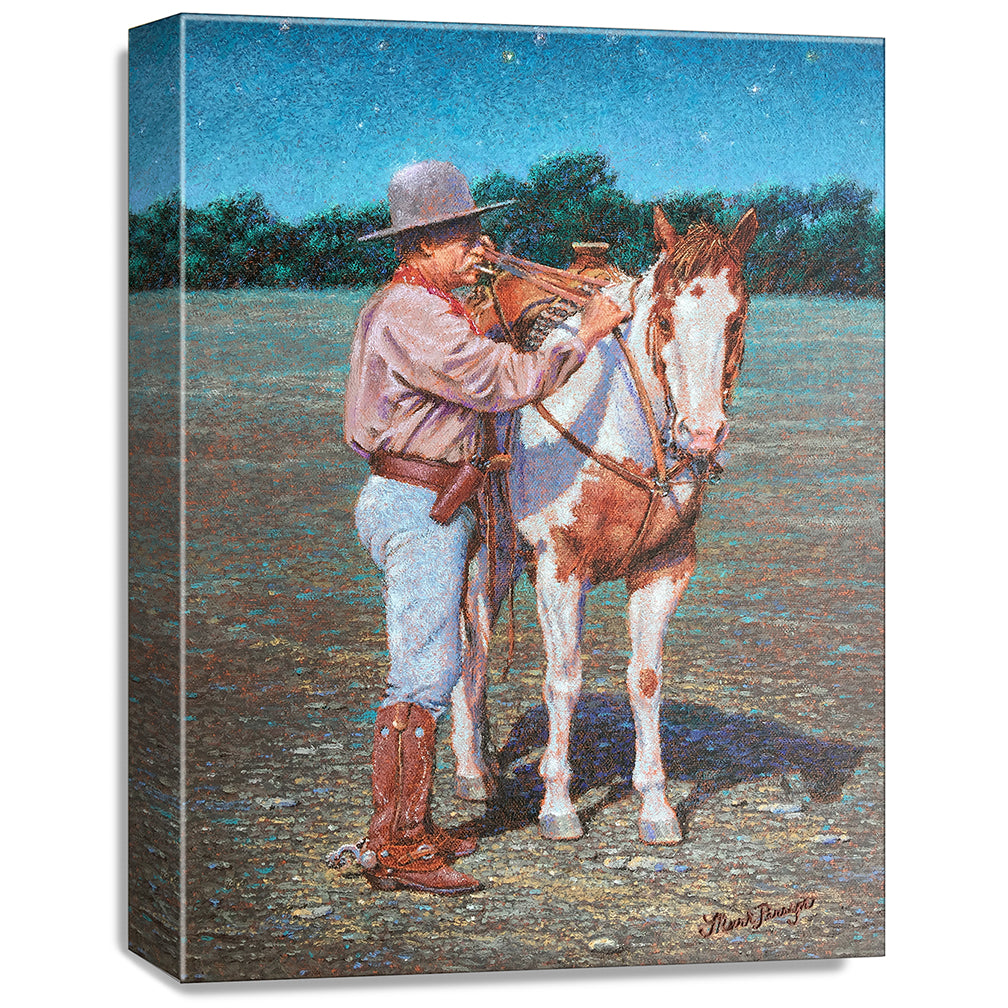 gallery wrapped print on canvas
depicting a cowboy standing
beside his paint horse saddling it under a twilight sky