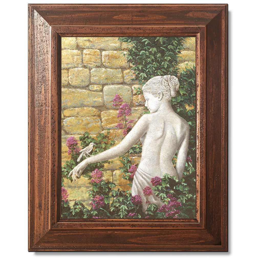 canvas print in a brown wood frame depicting a statue of a woman
with a bird on her arm in front of a rock wall with flowers