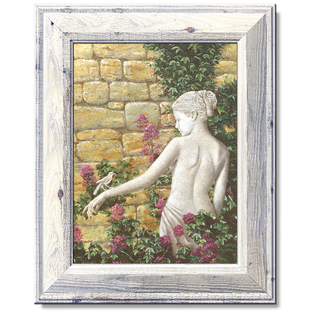 canvas print in a white wood frame depicting a statue of a woman
with a bird on her arm in front of a rock wall with flowers