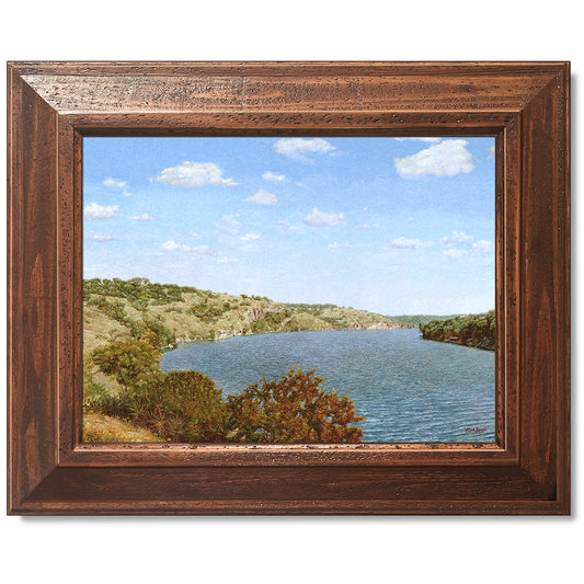 canvas print in a brown wood frame depicting one of the highland
lakes set in a country landscape under blue skies