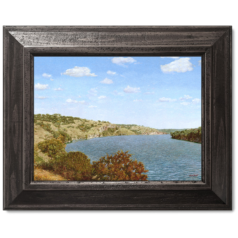 canvas print in a black wood frame depicting one of the highland
lakes set in a country landscape under blue skies