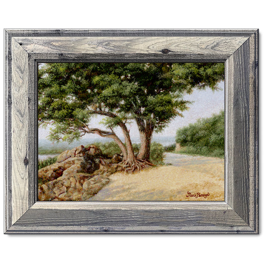 canvas print in a grey wood frame depicting a large oak tree
next to a country road