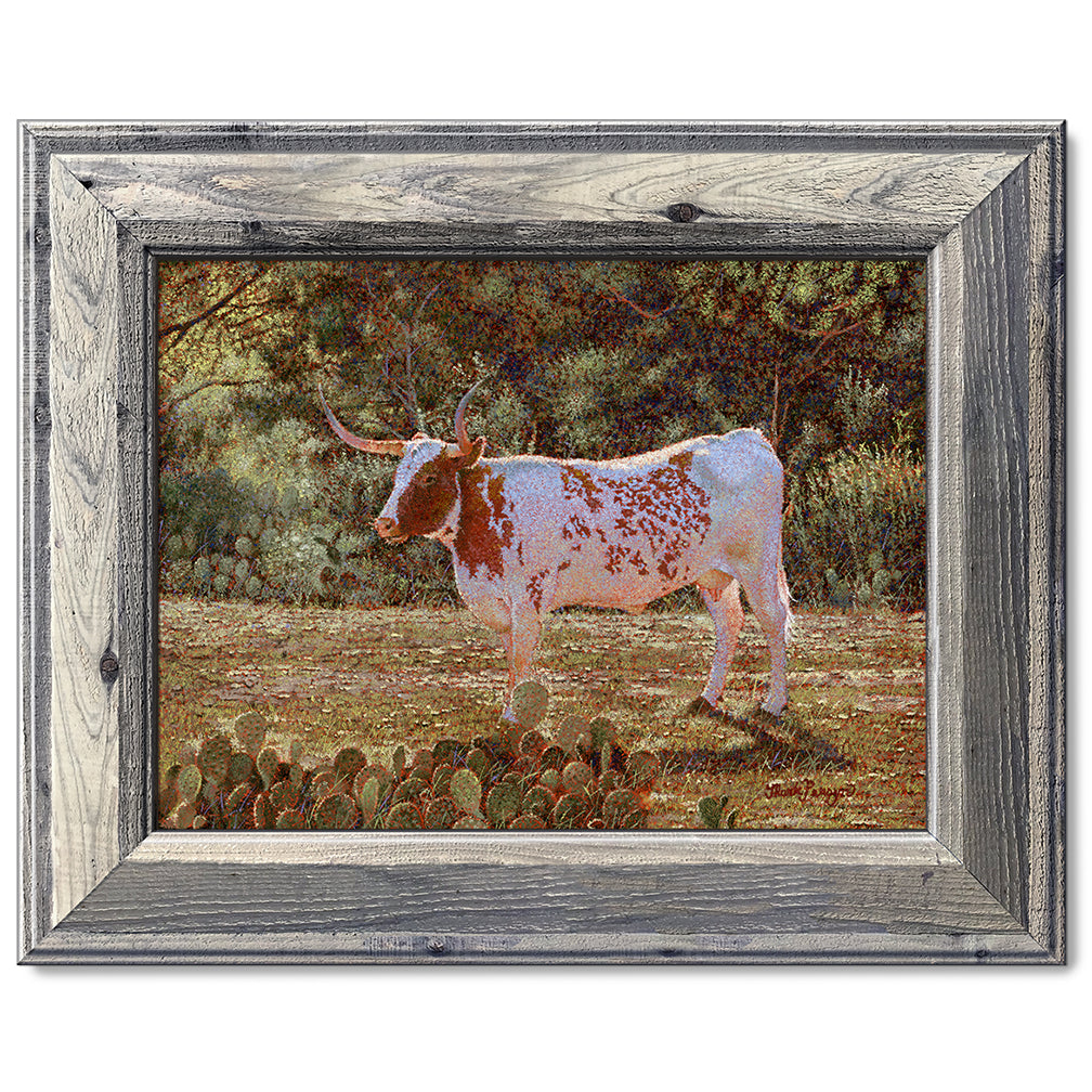 canvas print in a grey wood frame depicting a backlit longhorn standing in a field near kingsland, texas