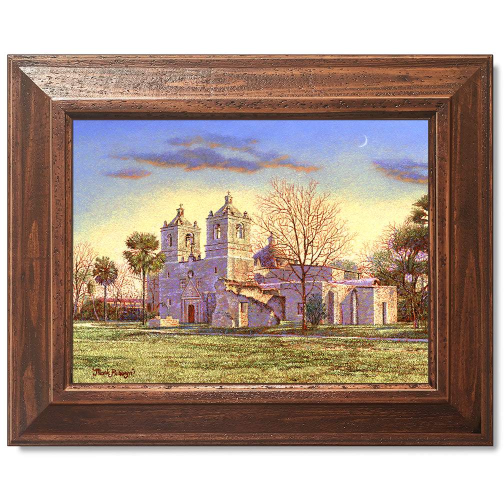 canvas print in a brown wood frame depicting a country landscape
with mission concepcion and a waning moon overhead