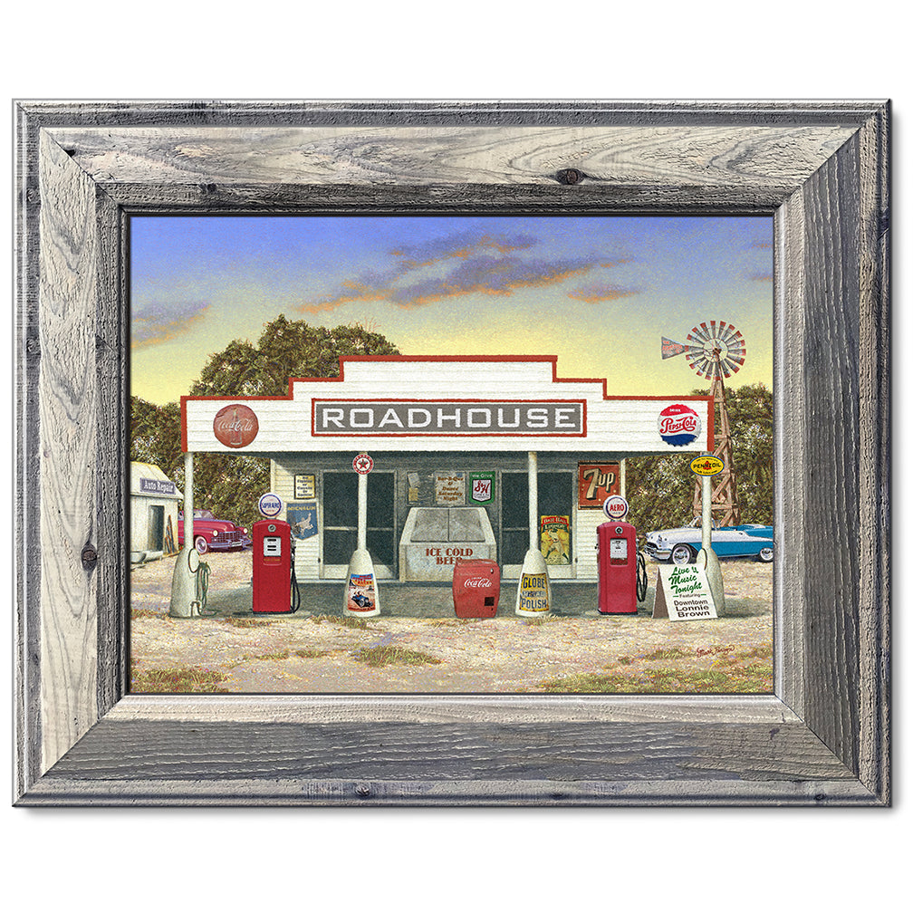 canvas print in a brown wood frame depicting a rustic roadhouse
with classic cars parked nearby