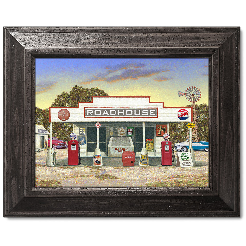 canvas print in a black wood frame depicting a rustic roadhouse
with classic cars parked nearby