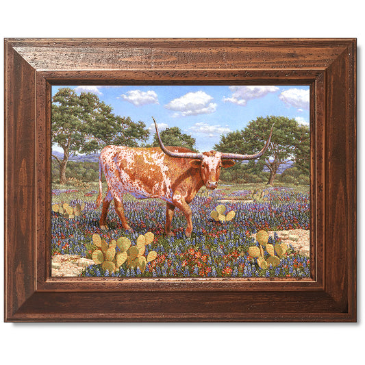 canvas print in a brown wood frame depicting a longhorn standing
in a country landscape with a texas shape on his side